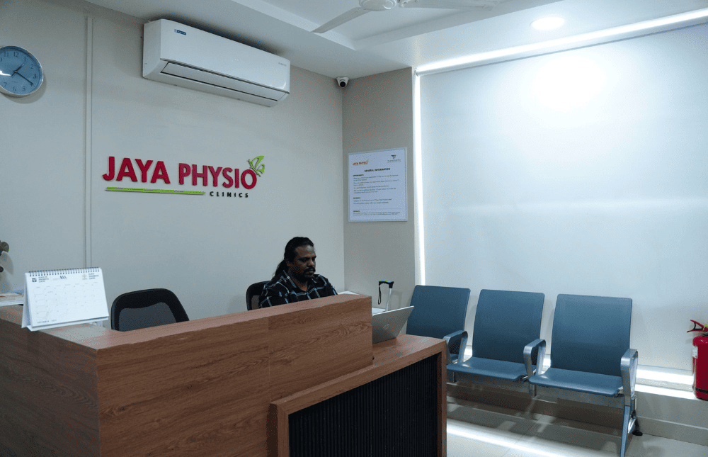 Physiotherapist guiding spinal rehabilitation exercises at Jaya Physio Clinics